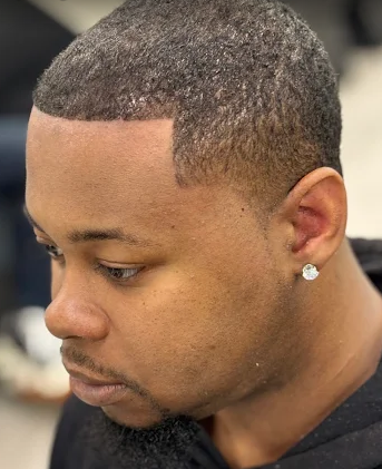 Short buzz cut with a sharp hairline